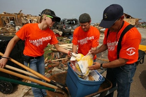 volunteers cleaning up after a disaster