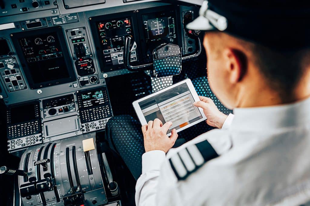 pilot using tablet with inflight connectivity